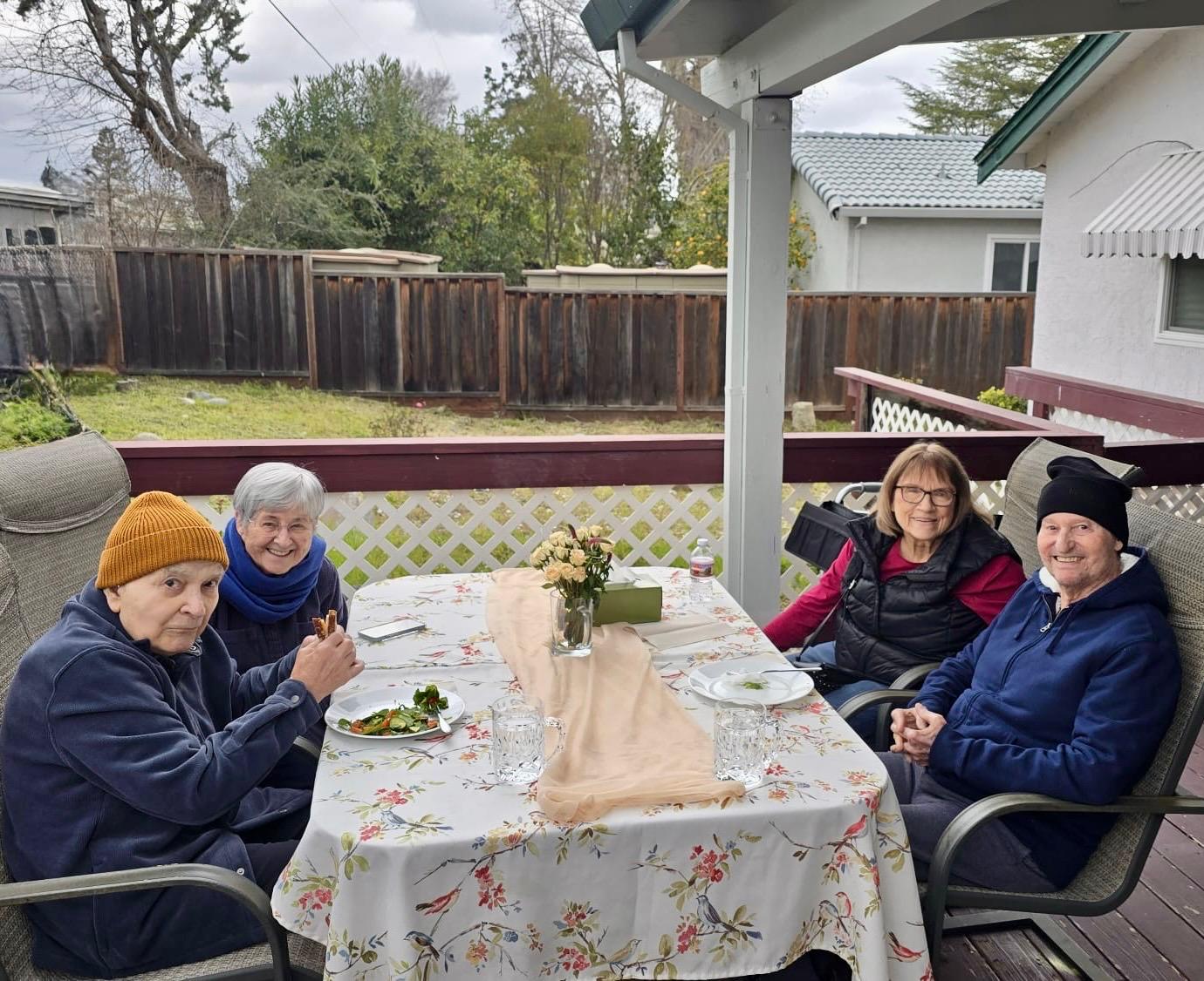 Residents enjoying outdoor activities on the patio